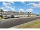 Modern condo building featuring attached garages, nicely landscaped grounds, and convenient parking at 15950 Grassland Ln # 2622, Punta Gorda, FL 33982