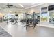 Spacious fitness center with strength and conditioning equipment, mirrors and expansive windows offering natural light at 15950 Grassland Ln # 2622, Punta Gorda, FL 33982