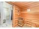 Well-lit sauna room with wood finishes and an adjacent shower area for convenience at 15950 Grassland Ln # 2622, Punta Gorda, FL 33982