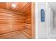 Relaxing sauna room featuring wood paneled walls, built-in benches, and a serene atmosphere at 15950 Grassland Ln # 2622, Punta Gorda, FL 33982