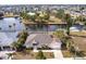 Aerial view of waterfront home with private dock at 164 Baldwin Se Ct, Port Charlotte, FL 33952