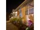 Night view of the home's exterior, beautifully lit at 164 Baldwin Se Ct, Port Charlotte, FL 33952