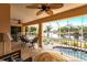 Covered lanai with water views and seating area at 164 Baldwin Se Ct, Port Charlotte, FL 33952