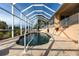 Inviting kidney-shaped pool with screened enclosure at 164 Baldwin Se Ct, Port Charlotte, FL 33952