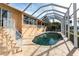 Inviting kidney-shaped pool with screened enclosure at 164 Baldwin Se Ct, Port Charlotte, FL 33952