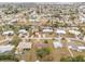 Aerial view of a residential neighborhood showcasing houses and waterways at 168 Dartmouth Nw Dr, Port Charlotte, FL 33952