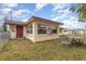 Backyard view showcasing a small patio and detached structure at 168 Dartmouth Nw Dr, Port Charlotte, FL 33952