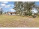 House exterior with a large yard and additional outbuilding at 168 Dartmouth Nw Dr, Port Charlotte, FL 33952