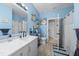 Nice bathroom, double vanity, and blue walls at 17654 Vellum Cir, Punta Gorda, FL 33955