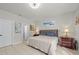 Comfortable bedroom with a king-size bed and access to a private bathroom at 17654 Vellum Cir, Punta Gorda, FL 33955