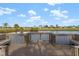 Wooden dock with benches overlooking pond at 17654 Vellum Cir, Punta Gorda, FL 33955