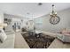 Living room featuring light sofas, a patterned rug, and an open floor plan at 17654 Vellum Cir, Punta Gorda, FL 33955