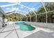 Inviting kidney-shaped pool with screened enclosure at 17654 Vellum Cir, Punta Gorda, FL 33955