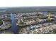 Aerial view of a canal-front home with private dock at 18042 Eau Gallie Cir, Port Charlotte, FL 33948