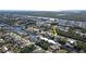 Aerial view of canal-front home with private dock and boat lift at 18042 Eau Gallie Cir, Port Charlotte, FL 33948