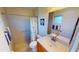 Bathroom with shower, toilet and wood vanity at 18042 Eau Gallie Cir, Port Charlotte, FL 33948