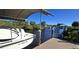 View of canal-front property with a private dock and boat at 18042 Eau Gallie Cir, Port Charlotte, FL 33948