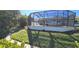 Landscaped backyard with walkway and cactus plants at 18042 Eau Gallie Cir, Port Charlotte, FL 33948