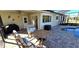 Enjoy this covered patio with pool access and grill at 18042 Eau Gallie Cir, Port Charlotte, FL 33948