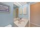 Small bathroom with light blue walls and a single sink vanity at 18395 Edgewater Dr, Port Charlotte, FL 33948