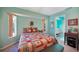 Comfortable bedroom with a queen-size bed and access to the bathroom at 18395 Edgewater Dr, Port Charlotte, FL 33948