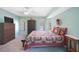 Spacious bedroom with a king-size bed, dresser, and calming color scheme at 18395 Edgewater Dr, Port Charlotte, FL 33948