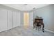 Bedroom with gray walls, white closet doors, and wood-look floors at 18395 Edgewater Dr, Port Charlotte, FL 33948