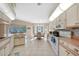 Well-lit kitchen with breakfast nook and pool view at 18395 Edgewater Dr, Port Charlotte, FL 33948