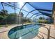 Screened-in pool with patio and plenty of sunlight at 18395 Edgewater Dr, Port Charlotte, FL 33948