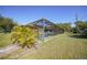 Screened pool area with patio furniture, offering a relaxing outdoor space at 18395 Edgewater Dr, Port Charlotte, FL 33948