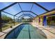 Enclosed pool area with a spacious patio and seating at 18395 Edgewater Dr, Port Charlotte, FL 33948