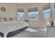 King-size bed in bright bedroom with large windows at 1848 Bobcat Trl, North Port, FL 34288