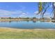 Peaceful lakefront view with lush landscaping and beautiful homes at 1848 Bobcat Trl, North Port, FL 34288