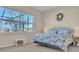 Main bedroom with a king-size bed and water views at 1848 Bobcat Trl, North Port, FL 34288