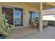 Enjoy dining alfresco on this covered patio overlooking the pool and lake at 1848 Bobcat Trl, North Port, FL 34288