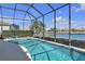 Enjoy this refreshing pool with a lovely view from its screened enclosure at 1848 Bobcat Trl, North Port, FL 34288