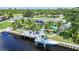 Canal front home featuring a large patio and boat dock at 192 Danforth S Dr, Port Charlotte, FL 33980