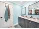 Modern bathroom with double vanity and gray cabinets at 192 Danforth S Dr, Port Charlotte, FL 33980