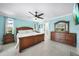 Spacious bedroom with wood furniture and light blue walls at 192 Danforth S Dr, Port Charlotte, FL 33980