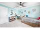 bedroom with twin bed, built-in shelving, and playful decor at 192 Danforth S Dr, Port Charlotte, FL 33980