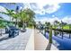 Private boat dock with walkway leading to a relaxing patio area at 192 Danforth S Dr, Port Charlotte, FL 33980