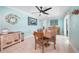 Dining room with wooden table and coastal wall art at 192 Danforth S Dr, Port Charlotte, FL 33980