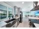 Modern kitchen with a farmhouse sink, stainless steel appliances, and white cabinets at 192 Danforth S Dr, Port Charlotte, FL 33980