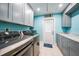 Laundry room with modern washer and dryer, and gray cabinets at 192 Danforth S Dr, Port Charlotte, FL 33980