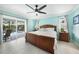 Main bedroom with king-size bed, direct access to the pool area at 192 Danforth S Dr, Port Charlotte, FL 33980