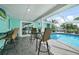 Enjoy this refreshing pool with bar-height seating nearby at 192 Danforth S Dr, Port Charlotte, FL 33980