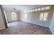 Spacious bedroom with hardwood floors and plantation shutters at 220 Shreve St, Punta Gorda, FL 33950