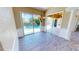 Bright dining room with hardwood floors and sliding doors to the pool at 220 Shreve St, Punta Gorda, FL 33950