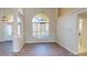 Dining room with hardwood floors and arched windows at 220 Shreve St, Punta Gorda, FL 33950