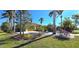 Single-story home with yellow exterior and palm trees at 220 Shreve St, Punta Gorda, FL 33950